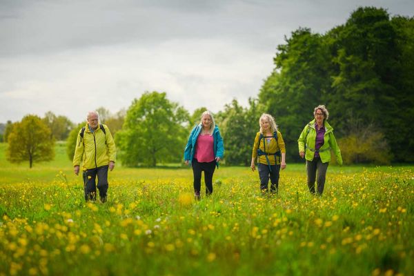 a group of walkers in enjoying a ramble in a field