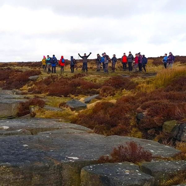 Ramblers leaping up on Derbyshire Edge
