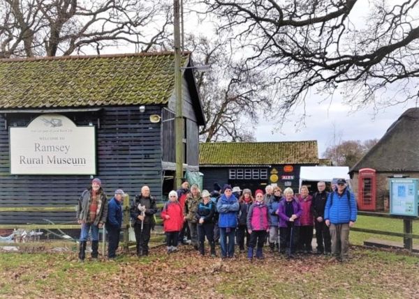 a group of walkers outside a rural museum