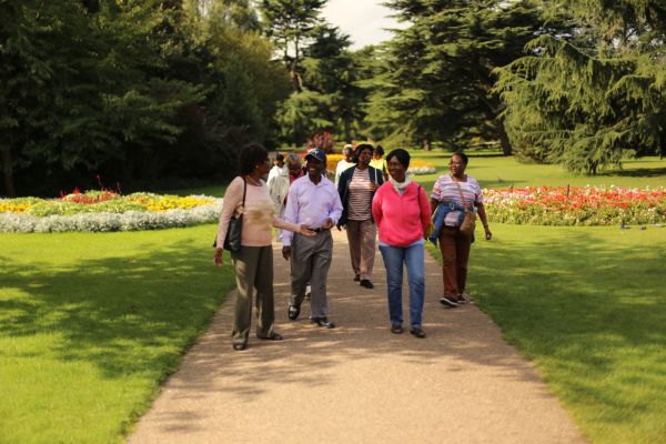 A group smiling whilst walking in Lewisham