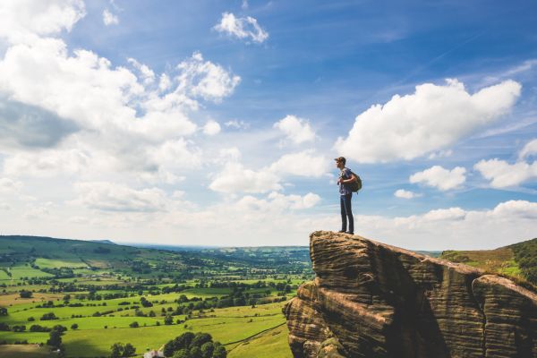 walker standing on a mountain edge 