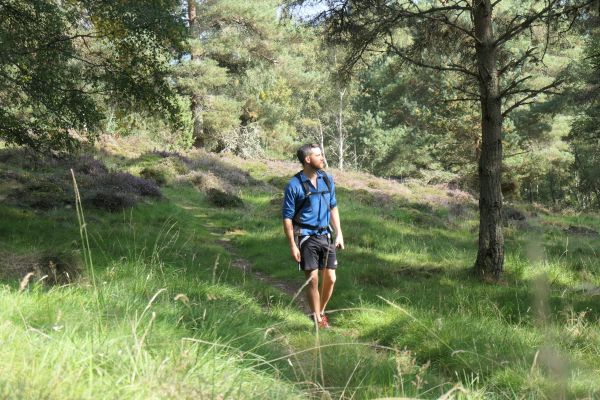 A walker on a narrow path in Kingussie hillside