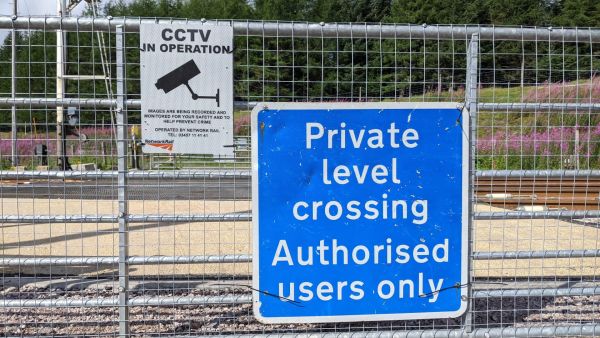 level crossing in Scotland showing private level crossing sign, authorised users only