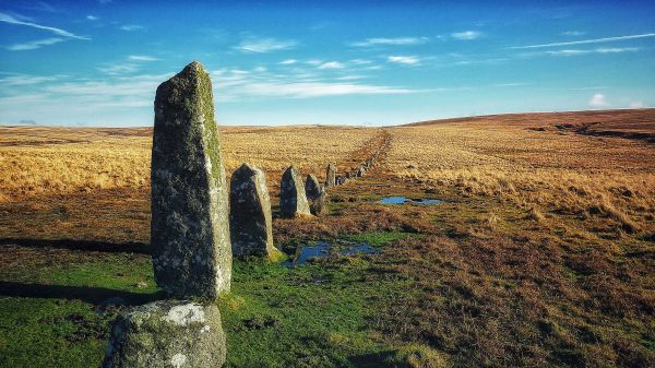 ancient stones in a line on a devon moor landscape