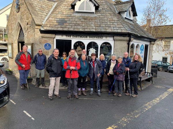 walkers in front of a town centre shop