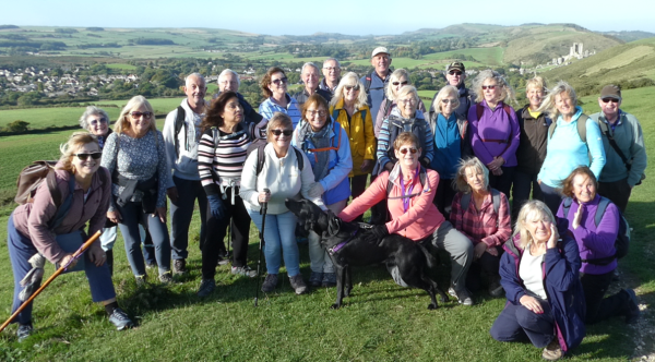 ramblers group photo with a dog in field